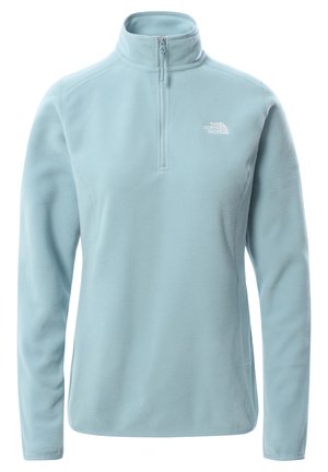 Jasnoniebieska bluza polarowa z długim rękawem, z zamkiem do ćwiartki i białym logo "The North Face" na lewej piersi.