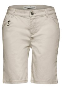 Beige shorts made of soft fabric. Features a zippered pocket with a silver pull and a front button closure. Clean stitching along the hem.