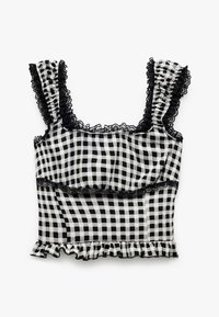 Czarnobiała bluzka w kratkę typu crop top z falbaniastymi ramiączkami, koronkowym wykończeniem i falbaniastym dołem. Wykonana z lekkiego materiału o teksturowanym wyglądzie.