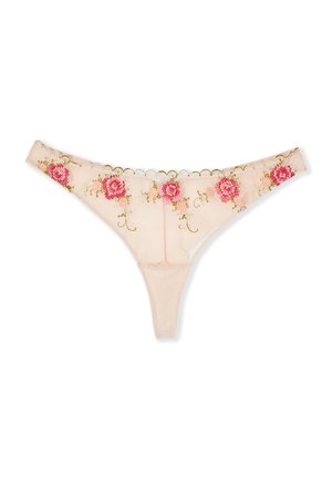 String beige transparent avec des motifs floraux brodés roses et rouges et des bords festonnés le long de la ceinture.
