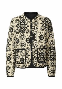 Veste beige avec motifs floraux et abstraits noirs, poches avant, bordure noire et fermetures traditionnelles chinoises à boutons grenouille.