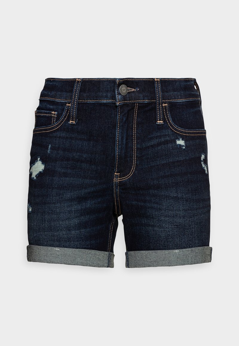 Pantalones cortos de mezclilla oscura con un diseño desgastado, dobladillos con vuelta y costuras doradas en contraste. Cuenta con bolsillos delanteros y cierre de botón.