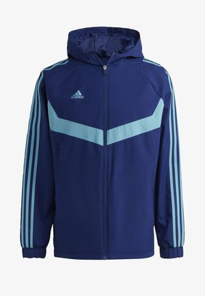 Veste à capuche Adidas bleu marine avec chevron bleu clair et trois bandes sur les manches, fermeture éclair à l'avant et poignets élastiques.