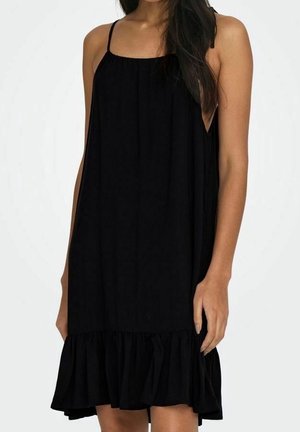 Vestido negro sin mangas de corte holgado, con escote fruncido y dobladillo con volantes para mayor detalle. Tejido suave y diseño minimalista.