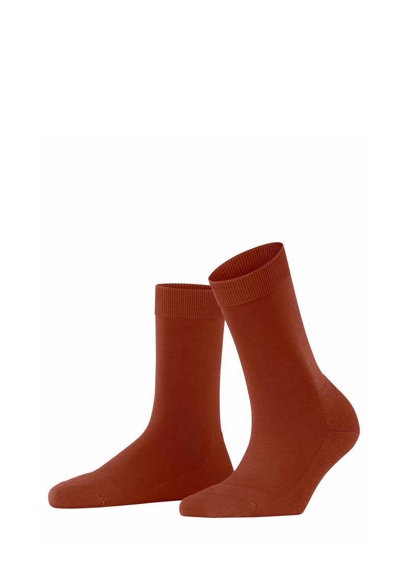 Baumwollsocken in Rostfarbe mit geripptem Bund, nahtloser Zehenpartie und passgenauer Form. Weicher Stoff, der für den Freizeitgebrauch geeignet ist.