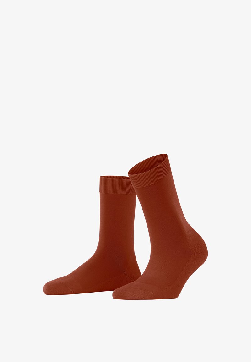 Baumwollsocken in Rostfarbe mit geripptem Bund, nahtloser Zehenpartie und passgenauer Form. Weicher Stoff, der für den Freizeitgebrauch geeignet ist.