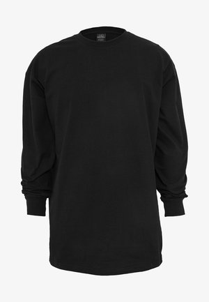 T-shirt noir à manches longues en coton. Doté d'un col rond et d'une coupe régulière. Textile lisse sans motifs ni accents visibles.