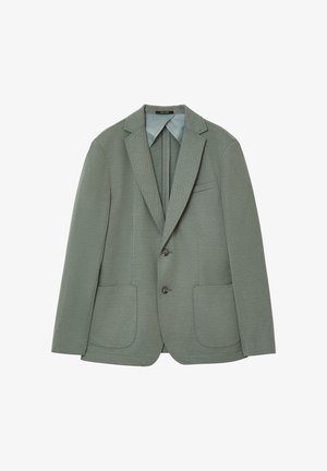 Blazer texturé vert clair avec deux poches avant, fermeture à un bouton, revers crantés et doublure intérieure contrastante.