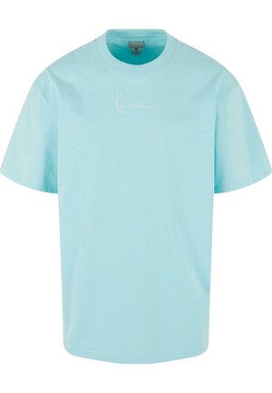 Light blue cotton t-shirt with a crew neck and short sleeves. Features a subtle white embroidered logo on the chest. Soft texture.