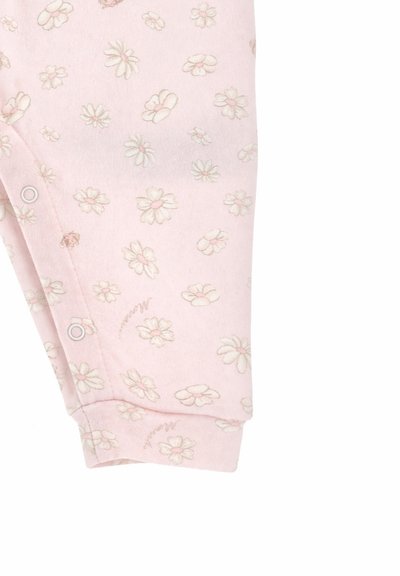 Tessuto rosa con piccoli motivi floreali di margherite bianche e rosa chiaro e bottoni a pressione lungo la cucitura.