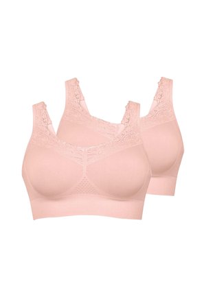 Tre reggiseni wireless rosa morbidi con bordatura in pizzo, spalline larghe e coppe seamless mostrati su sfondo bianco.