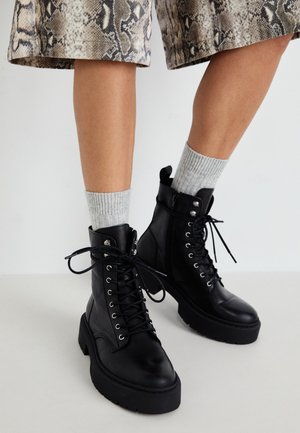 GUSTO - Platform ankle boots - black