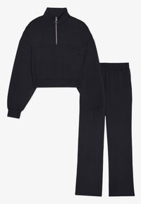 Black matching set featuring a cropped, zip-up sweatshirt with high collar and long sleeves, paired with straight-leg pants. Soft, stretchy fabric.