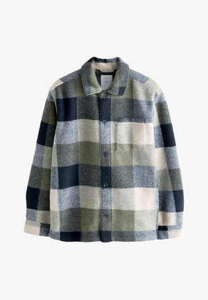 Tjekket flannel skjorte i grøn, marineblå og creme. Har krave, frontlomme og knaplukninger. Blød tekstur med en afslappet pasform.