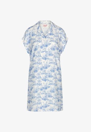 Witte jurk met korte mouwen, knoopsluiting, blauwe bloemen- en palmboomprint en kraag, met het label Triumph bij de halslijn.