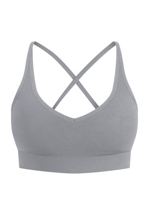 Brassière de sport grise avec un design en V, fines bretelles et dos croisé. Fabriquée en matériau doux avec une bande sans couture pour plus de confort.