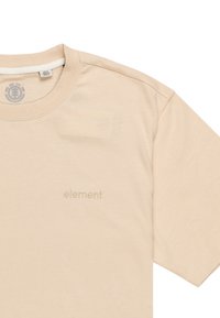 Beige bavlněné tričko s krátkým rukávem, které má decentně vyšitý logo "element" na hrudi a kulatý výstřih.