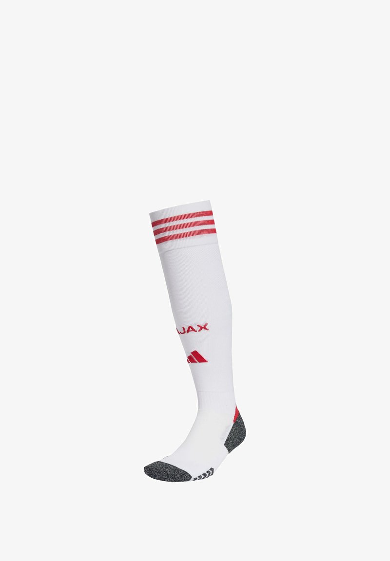 White knee-high sock with red stripes at the top, featuring red branding on the shin and gray accents on the heel and toe.