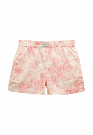 Helle beigefarbene Shorts mit pinkem tropischen Muster, das Segelboote und Palmen zeigt. Elastischer Bund mit Markenetikett. Baumwollstoff, lässiges Design.
