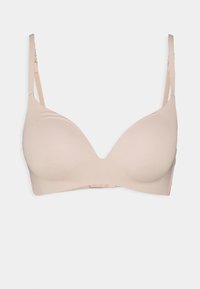 Light beige bra with smooth, molded cups, adjustable straps, and a secure hook-and-eye closure. Minimalist design, no visible patterns.