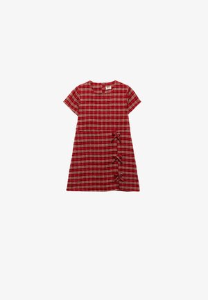 Punainen ruudullinen mekko lyhyillä hihoilla, pyöreällä kaula-aukolla ja kolmella koristeelliset solmulla vasemmalla puolella. Pehmeä, teksturoitu kangas rentoa istuvuutta varten.