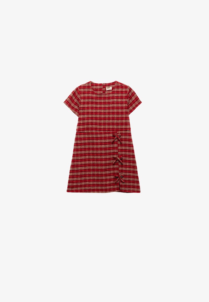 Abito a quadri rossi con maniche corte, scollatura tonda e tre fiocchi decorativi sul lato sinistro. Tessuto morbido e strutturato con una vestibilità comoda.