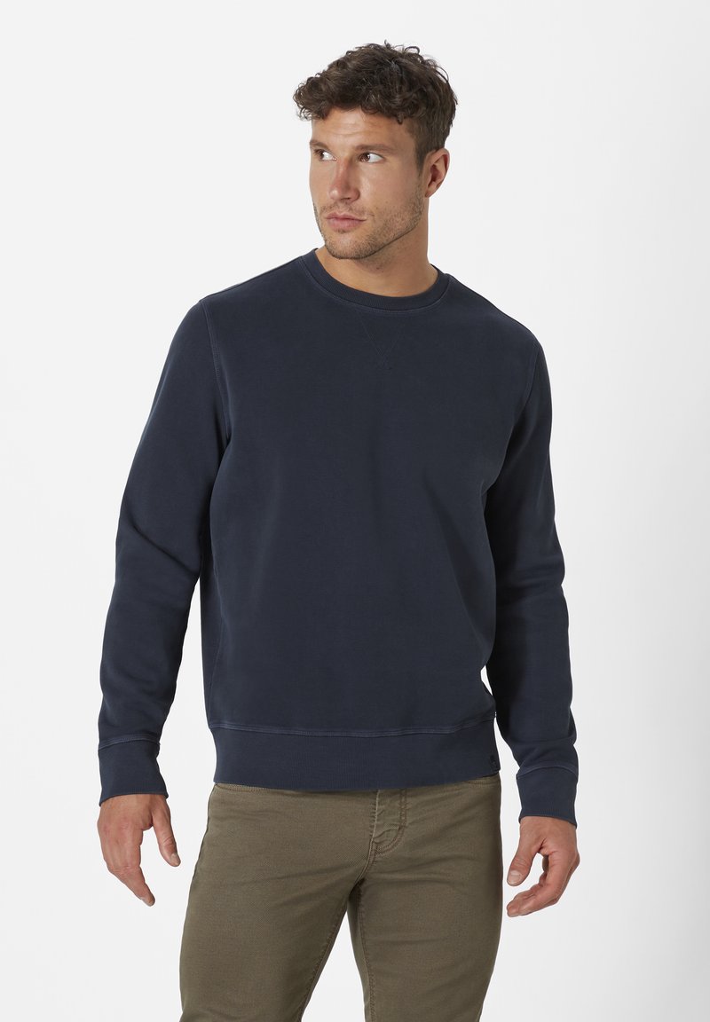 Dunkelblaues Sweatshirt aus weicher Baumwolle, mit Rundhalsausschnitt, langen Ärmeln und gerippten Bündchen und Saum. Lässiges Design.