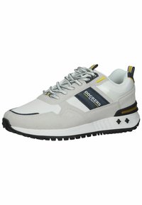 Gray and white sneaker with a suede and mesh upper, black rubber sole, and blue and yellow accents. Features round laces and branding.