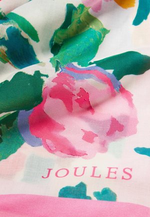 Tkanina w kwiaty z dużymi różowymi i zielonymi kwiatami w stylu akwareli oraz słowem "JOULES" nadrukowanym na różowo.