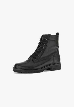 Black leather ankle boots with a rounded toe, contrasting stitching, six eyelet lacing, and a textured rubber outsole. Pull tab at the heel.