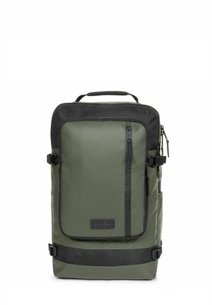 Green backpack with black accents, featuring a zippered pocket, top handle, adjustable straps, and a sturdy, textured material.