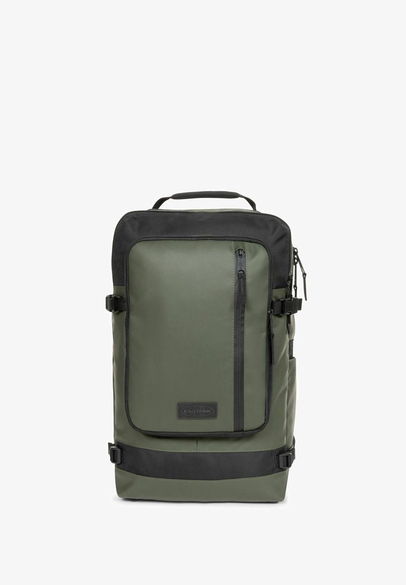 Vihreä reppu mustilla yksityiskohdilla, jossa on vetoketjullinen tasku, yläkantokahva, säädettävät olkaimet ja kestävä, teksturoitu materiaali.