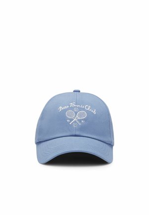 Light blue baseball cap with embroidered white text "Bass Tennis Club" and two crossed tennis rackets with the year 1997.