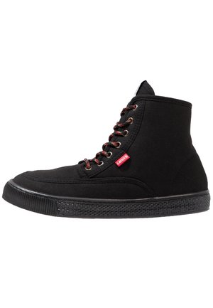 Black high-top canvas sneaker with red and black laces, textured rubber sole, and red Levi's logo tag on the side.
