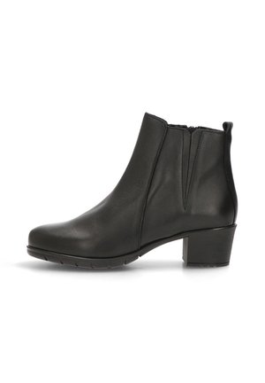 Bota de tobillo de cuero negro con punta redonda, costura mínima, gomas laterales y un tacón grueso. La suela de goma proporciona tracción.