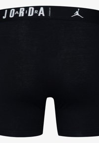 Zwarte boxershorts met een contrasterende witte elastische tailleband met de tekst en het logo "JORDAN", gemaakt van soepel, zacht stof.
