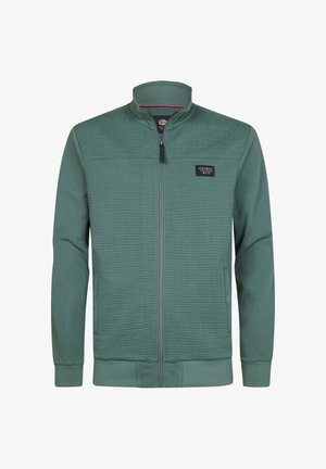 Giacca verde con zip, caratterizzata da una texture trapuntata sulla parte superiore anteriore, polsini e colletto a coste. Presenta una toppa con il logo sul lato sinistro del petto.