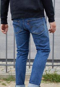 Levi's® 512® SLIM TAPER - Calças de ganga justas - medium indigo stonewash