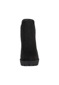 Botín negro de ante hasta el tobillo con punta redondeada, textura suave y suela de goma gruesa con tracción para agarre. Vista trasera que muestra el diseño superior.