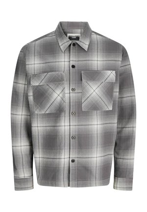 Chemise à carreaux grise et blanche, avec deux grandes poches à rabat sur la poitrine et un col classique.