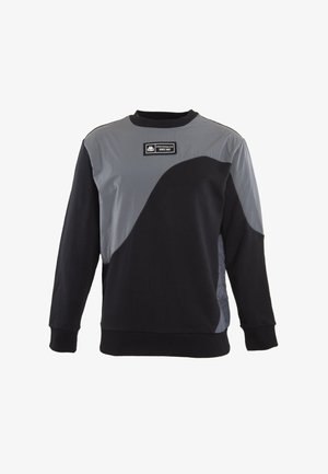 Felpa nera con pannello grigio, design curvo. Presenta un collo rotondo e un tessuto testurizzato sui lati. L'etichetta sul petto riporta la scritta "Dal 1987".