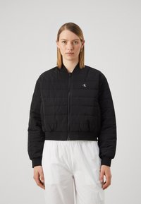 Calvin Klein Jeans QUILTED - Overgangsjakke - black