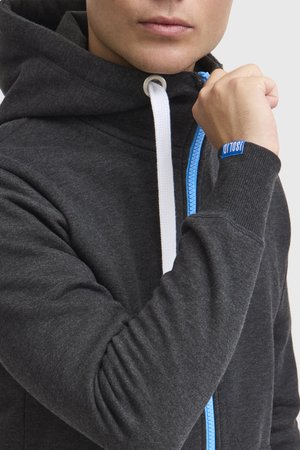 Dark gray hoodie with a blue zipper and white drawstrings. Features ribbed cuffs and a logo tag on the wrist. Plain texture, front view.