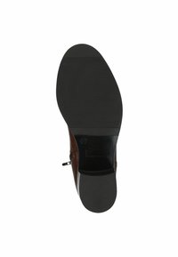 Bottine en cuir marron avec une texture lisse et une semelle en caoutchouc noir. Équipée d'une fermeture éclair sur le côté et d'un motif de semelle minimal.