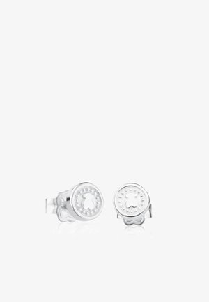 Small silver stud earrings with round faces featuring a cutout teddy bear shape and dotted border details.