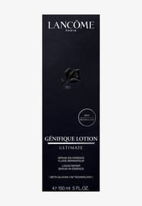 La loción Génifique de Lancôme presenta un envase negro elegante con texto plateado, un gráfico de rosa y una etiqueta de "Nueva Tecnología". Tamaño de 150 ml.