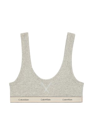 Lichtgrijze beha met brede schouderbanden, een ronde halslijn en een zachte stof. Heeft een contrasterende beige band met de tekst "Calvin Klein".