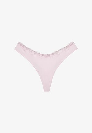 Light pink thong underwear featuring a scalloped lace trim along the waistband. Soft fabric with a smooth texture, minimalistic design.