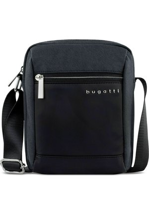 Black crossbody bag made from durable fabric, featuring a front zip pocket, silver hardware, and a adjustable strap. Logo displayed prominently.