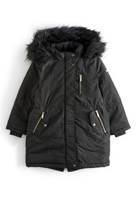 Parka matelassée noire avec capuche bordée de fourrure, détails en fermeture éclair dorée et deux poches latérales. Présente une coupe décontractée et des poignets côtelés.